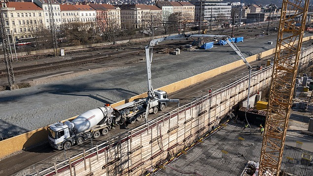 Concrete pump and truck mixer in action on a major construction site for infrastructure and transport networks